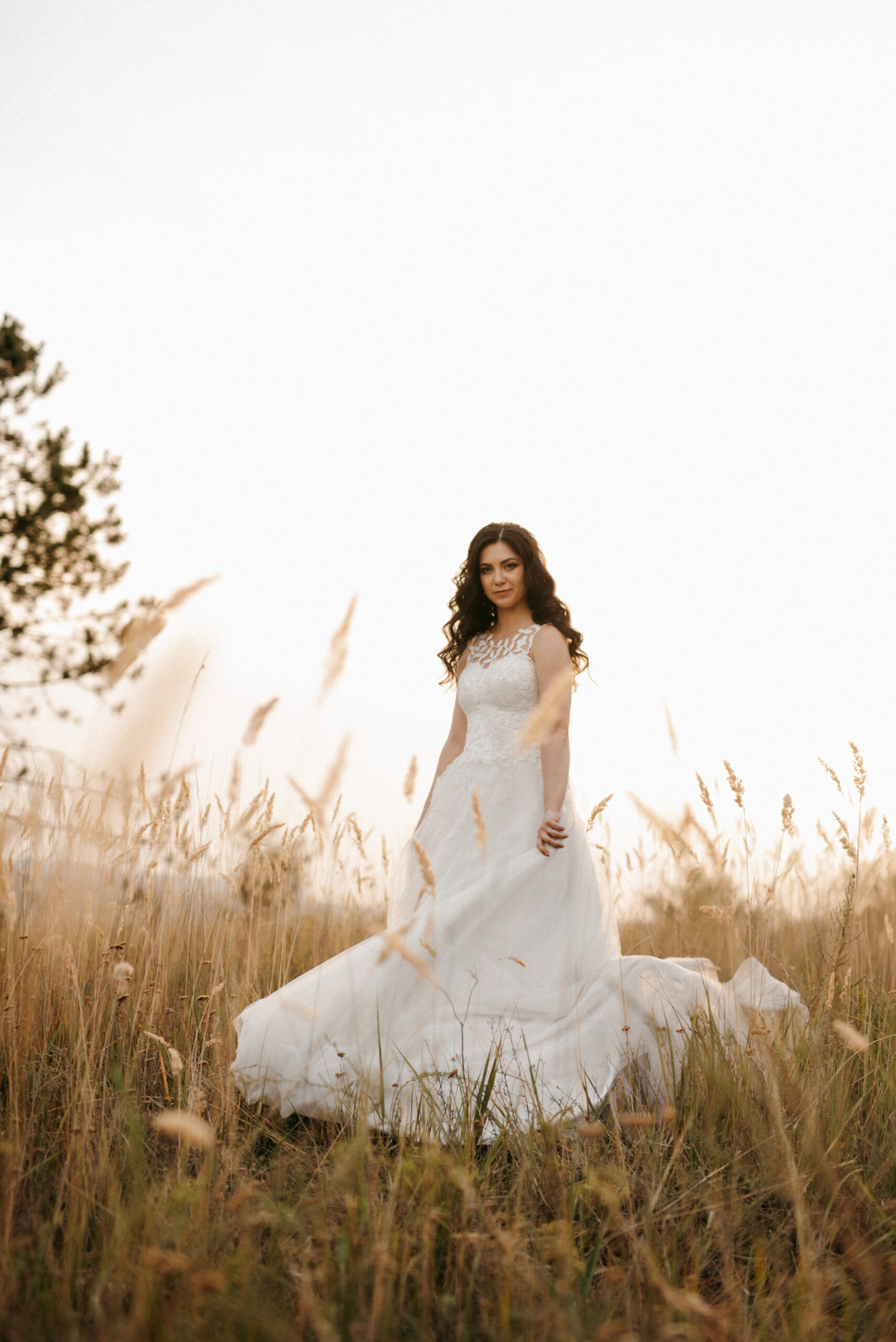 girl are walking along the green hills near the river